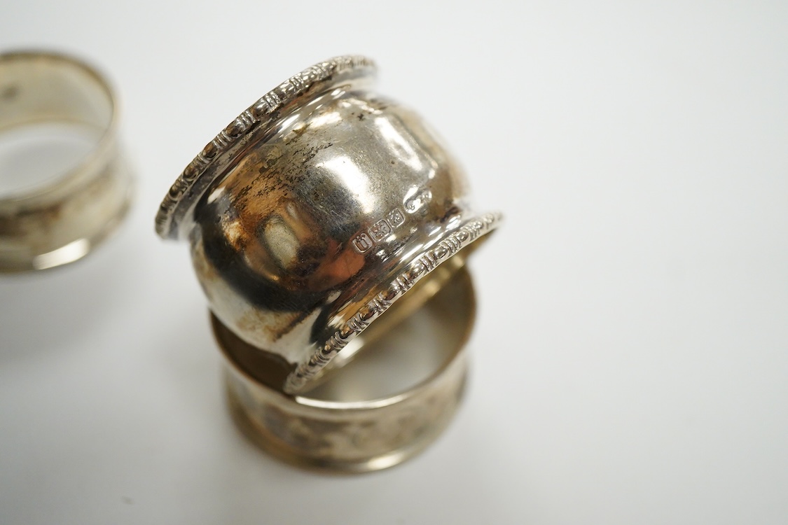 An Elizabeth II cased silver christening trio, Birmingham, 1959/60, together with three silver napkin rings.